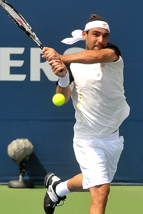 Marcos Ousts Cilic In Opener