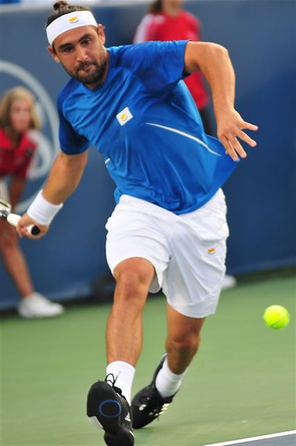 Federer Ends Marcosâ€™ Run