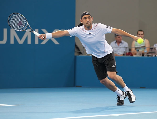 Marcos Prevails In Tight Opener