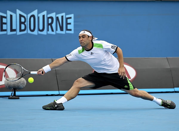 Marcos Battles Through Opener