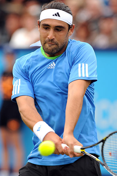 Marcos Eases Into Quarter-Finals