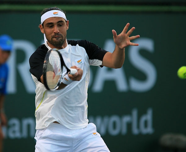 Marcos Falls In Clay Opener